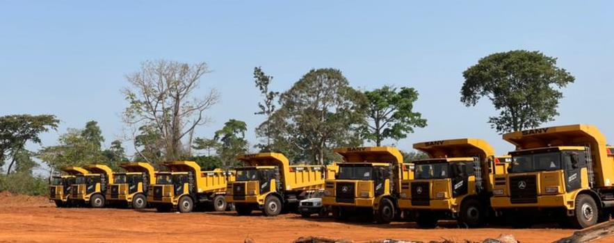 Figure 7- Tietto’s dump truck fleet ready to commence work at Abujar.png
